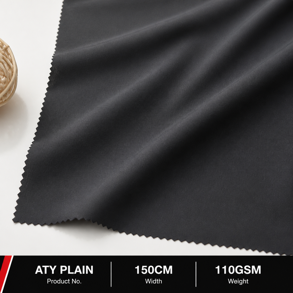 Black ATY Plain polyester windbreaker fabric draped to show its smooth solid surface
